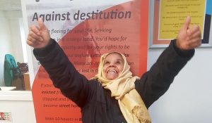happy woman who has just got refugee status