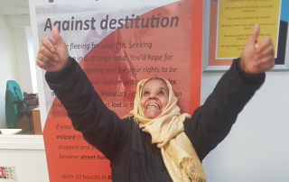 Woman happy after getting refugee status